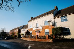 The Red Lion Inn sits at the centre of the village