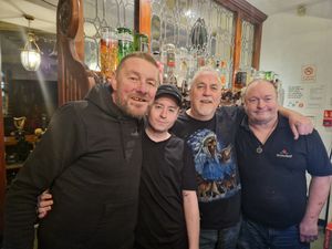 Michael Cartwright (Third left) and his staff behind the bar of The Mitre