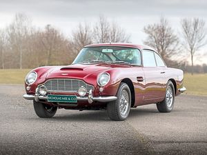 The red DB5 is a 1965 model 
