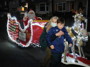 Supporting image for story: Santa visits boy who spent Christmastime in hospital