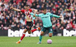 SUNDERLAND, ENGLAND - OCTOBER 18: Joao Gomes of Wolverhampton Wanderers battles for possession with Granit Xhaka of Sunderland during the Premier League match between Sunderland and Wolverhampton Wanderers at Stadium of Light on October 18, 2025 in Sunderland, England. (Photo by Stu Forster/Getty Images)