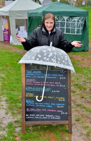 Donna Miles from 'The Ginger Cow' with an alternative use for her brolly, keeping her menu dry