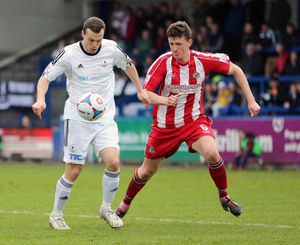 Shaun Whalley of AFC Telford United and Scott Leather of Altrincham