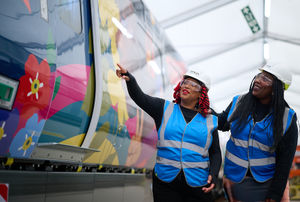 Onboard Chef Marcia Graver (right) at the unveiling of a new train wrapped in a bespoke artwork
