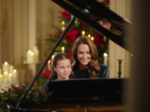 Supporting image for story: Kate and Charlotte perform together on the piano for royal carol concert