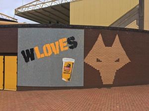Supporting image for story: Bansky-like graffiti shows Wolves 'love'