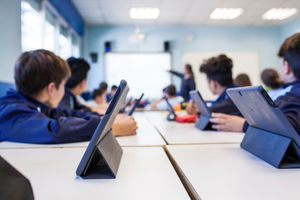 Students working on tablets at school