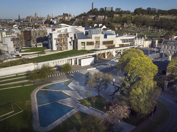 Members of the Scottish Parliament seated in the debating chamber at Holyrood during a session on the Assisted Dying Bill