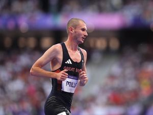 George Mills running at the Paris Olympics