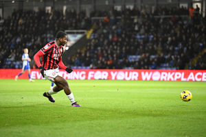 Daniel Kanu rolls in his 10th goal of the season for Walsall.