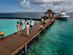 Foreign tourists arrive in a resort in the Kurumba island