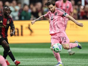 Inter Miami captain Lionel Messi, right, in action against Atlanta