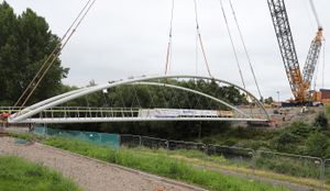 The new bridge being lifted into place.