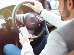 Supporting image for story: Police catch more than 100 motorists using their phone while driving