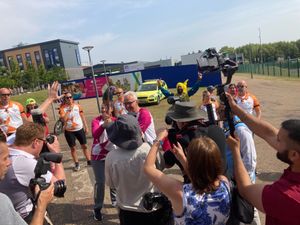Wrekin rower Stuart Richards carries the baton through Southwater joined for a while by brother Gary 