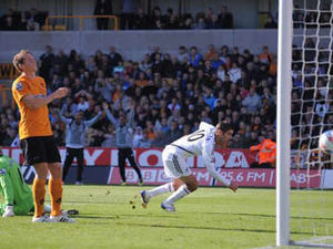 Supporting image for story: Wolves 2 Swansea 2 - in pictures
