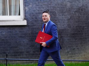 Wes Streeting in Downing Street carrying a red file