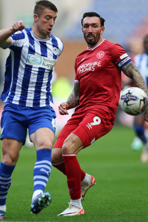 Charlie Hughes of Wigan Athletic and Ryan Bowman of Shrewsbury Town (AMA)