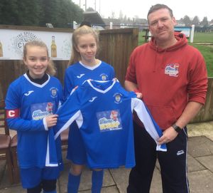 Nick Dodd, of sponsor Disco Daddy, presenting the new kit to captain Lucy and vice captain Esther.