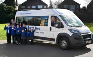 Headteacher Jayne Bayliss gets into the driving seat of the new minibus at Burnt Tree Primary School, Oldbury. Also pictured are deputy head Matt Brazier and pupils. (Photo credit: Tim Thursfield/National World)