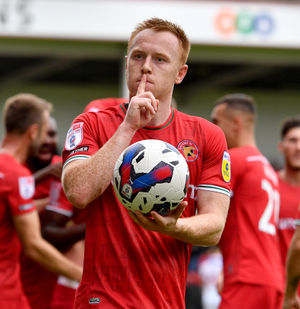 Hat trick hero Danny Johnson celebrates his third..