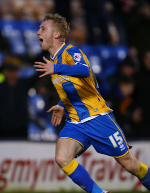 Jack Grimmer of Shrewsbury Town celebrates after he scores to make it 3-2