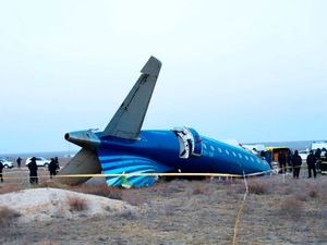 Part of the Azerbaijan Airlines’ Embraer 190 lies on the ground near Aktau airport in Kazakhstan