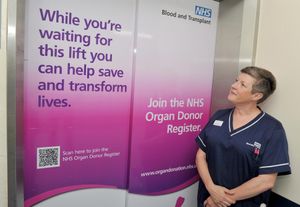 Fiona Deakin, an organ donation specialist nurse at SaTH, with the messages that have been put on lift doors 