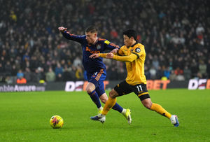 Newcastle United's Harvey Barnes (left) and Wolverhampton Wanderers' Hwang Hee-Chan battle for the ball. Picture: PA