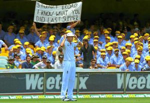Australian supporters hold a banner as England's Stuart Broad fields on the boundary
