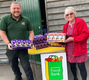 Leominster Food Bank Trustee and volunteer Anne Clarke receives a delivery of Easter Eggs from Lock Stock Self-Storage Area Manager Richard Warner.