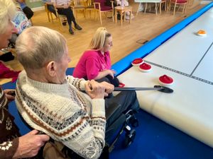 Residents at Uplands Care Home in Shrewsbury have been having a go at indoor curling