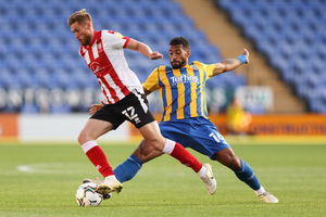 Teddy Bishop of Lincoln City and David Davis of Shrewsbury Town. (AMA)