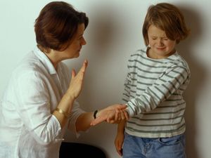 Woman smacking child
