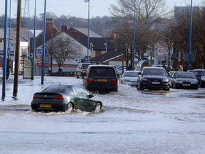 Supporting image for story: Flood shock closes street