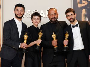 From left, Basel Adra, Rachel Szor, Hamdan Ballal and Yuval Abraham, winners of the award for best documentary feature film for No Other Land, in the press room at the Oscars in March