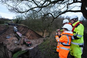 Waterways engineers inspect an area where two boats remain within a large "sinkhole" which breached a canal in the Chemistry area of Whitchurch in December. Photo credit: Jacob King/PA Wire 