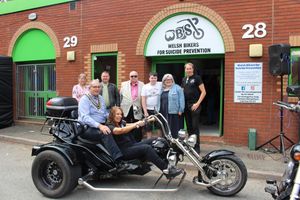 The Mayor Councillor Peter Lewington on a trike with Helen Kidd, with fellow town councillors. Image by Sophie Green