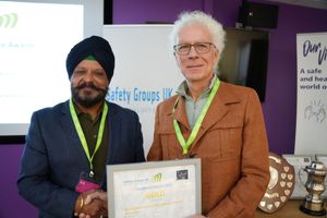 Paul Singh, BHSEA Training Committee Member receiving the Gold Excellence Award from Richard Bate IOSH President Elect.