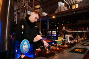Jack Hughes pulling pints
