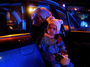 Supporting image for story: Mothers and young children queue to return to Ukraine at Polish train station