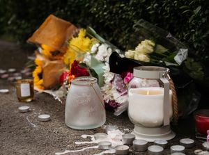 Supporting image for story: Emotional candlelit vigil held as community at heart of daylight murder probe stands shoulder-to-shoulder with grieving man's family