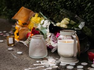 Supporting image for story: Emotional candlelit vigil held as community at heart of daylight murder probe stands shoulder-to-shoulder with grieving man's family