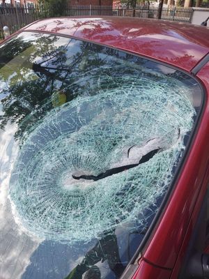 The slab smashed through the vehicle's front window, injuring a passenger