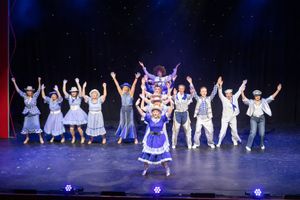 An enthusiastic ensemble performing “Go West.”