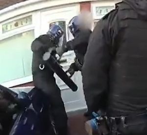 Police smashed their way in the front door during the dawn raid.  Photo: West Midlands Police 