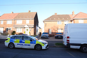 A police car at the scene at Burcot Avenue in Wolverhampton, where a 30-year-old man was stabbed to death on Christmas Day. 