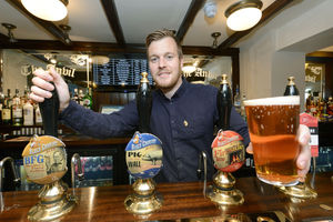 Tom Sutton behind the bar at The Anvil
