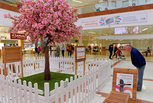 A shopper next to the Merry Hill 'tweet tree'