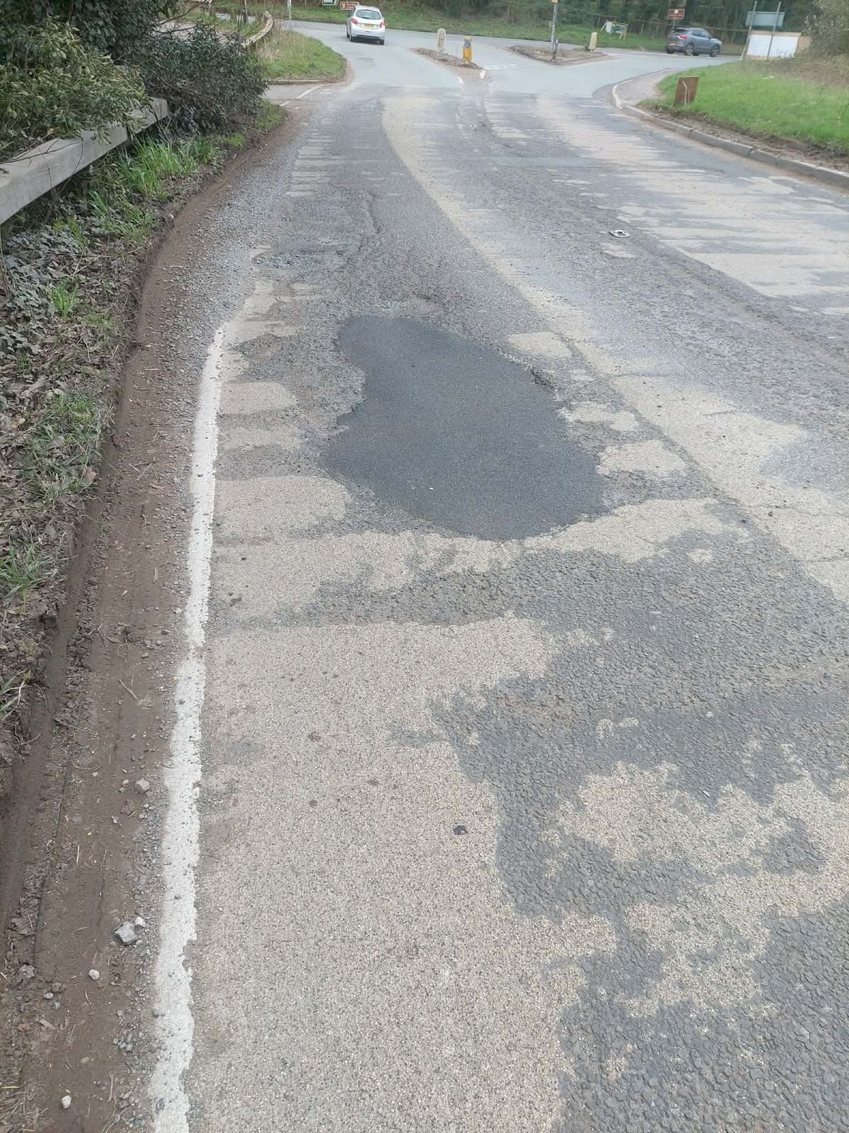 Dreadful section of road - Motorist takes things into his own hands to warn about potholes at busy Shropshire junction